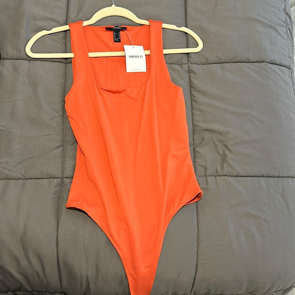 Orange body suit